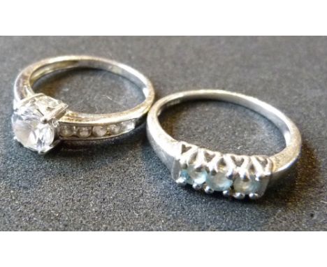 A 9ct. Gold White Gold Band Ring together with another similar 9ct. white gold ring