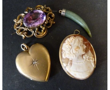 A Large Heart Shaped Locket, set with a solitaire diamond, together with a cameo brooch with 9ct. gold frame and amethyst set