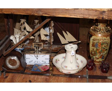 Large Oriental vase, red resin figurines, Ironstone wash bowl and jug, mantel clock, wooden boat, cast iron door stop, sword.