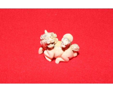 Antique ivory netsuke of beast with cub