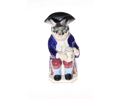 Antique Staffordshire toby jug with pipe and beer mug