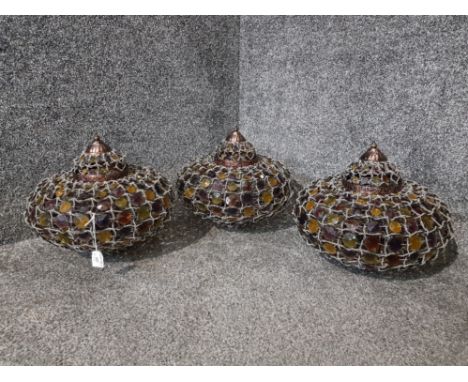 Three modern Indian style ceiling light fittings.