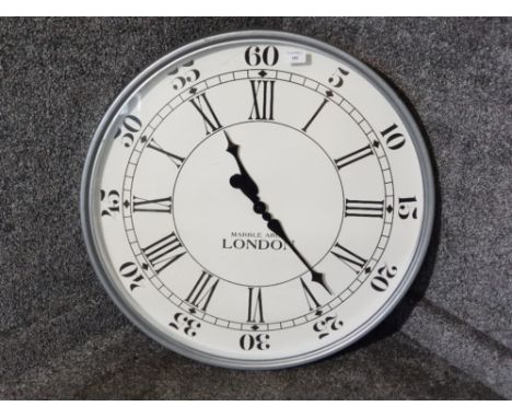 A large wall clock "Marble Arch London".