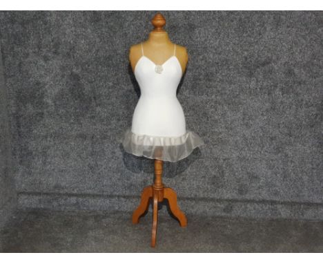 Ballerina mannequin with white tutu