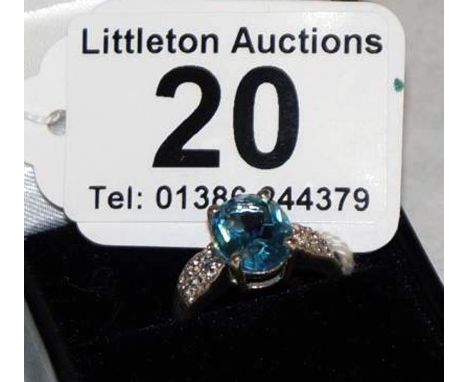 Silver blue topaz set ring