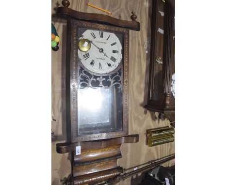 A Victorian inlaid walnut wall clock by J W Hughes LlanellyThe inlaid and glazed door enclosing a 21cm painted dial with Roma