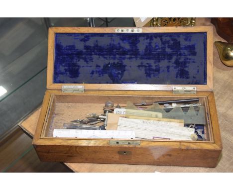 An oak cased drawing set, early 20th Century The case of rectangular form, with brass applied plaque 'H.O Baldry' encased wit