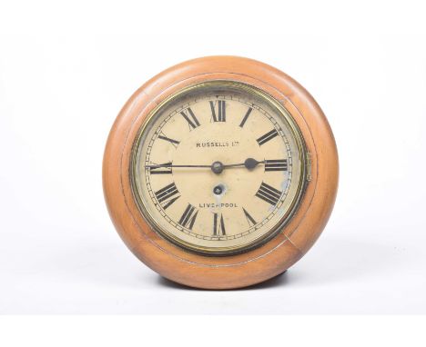 An early 20th Century wall clock by Russell's Ltd, LiverpoolHaving an 18cm painted dial with Roman numerals centred with the 
