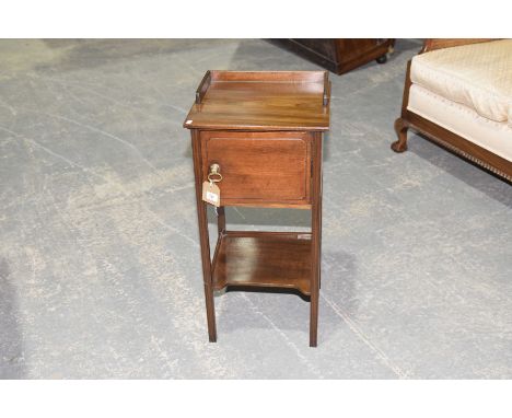 A 19th Century mahogany night stand The square gallery top above a single cupboard door and a lower shelf, raised upon slende