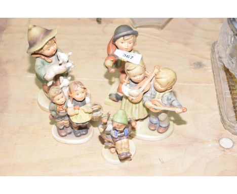 A group of five Hummel figuresThe figures in typical glaze depicting young children playing, looking after lambs, playing ins