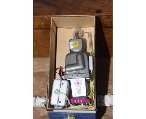 A boxed 'Radar Robot' blinking light battery operated toy The robot toy with remote control and light up eyes made by Tin Tom