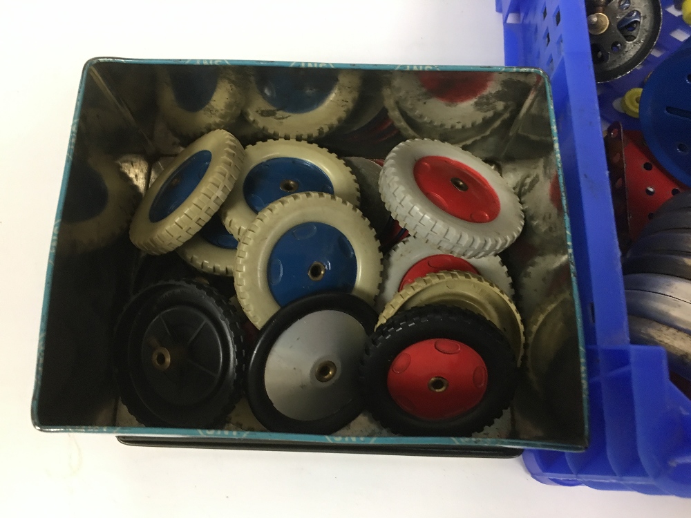 QUANTITY OF ASSORTED VINTAGE MECCANO WHEELS, SOME WITH TYRES, MOST RED