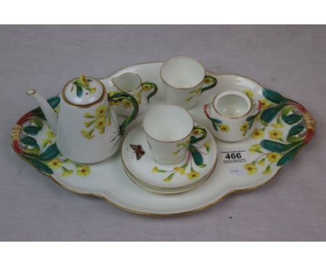 Late 19th Cenutry tete a tete ceramic with floral decoration consisting of teapot, sugar bowl, cups, saucers and tray, regist