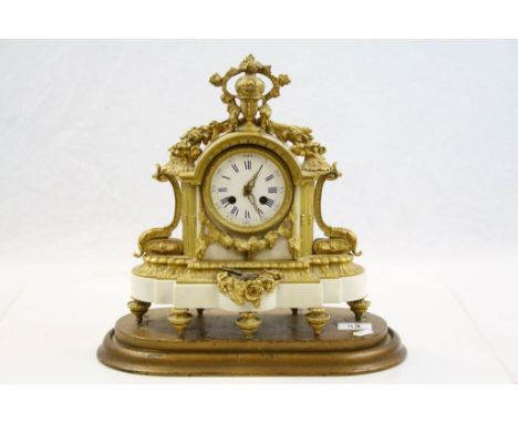 19th Century French White Marble &amp; Ormolu Striking Mantle Clock with Enamel Dial &amp; Roman numerals on a Gilt wooden st