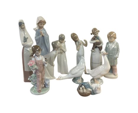 Four Lladro figures, including Girl holding bird no 5217, Duck and Ducklings no 4895 etc, together with Nao and similar figur