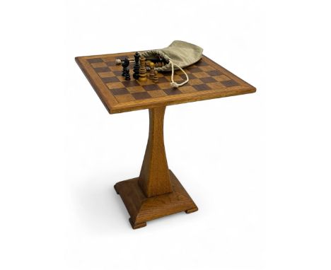 Mid-to-late 20th century oak chess table, square top with inlaid chessboard supported on a tapered pedestal over a stepped sq