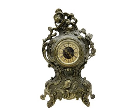 A 20th century brass cased spring driven mantle clock and early 20th century oak cased aneroid barometer.