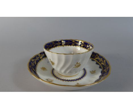 A Worcester Cobalt Blue, Gilt and White Tea Bowl and Saucer with Bee Pattern 