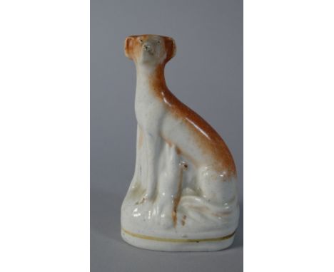 A 19th Century Ceramic Seated Greyhound Figure, 10cm high 