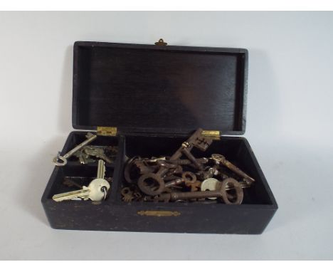 An Ebonised Box Containing Vintage Keys