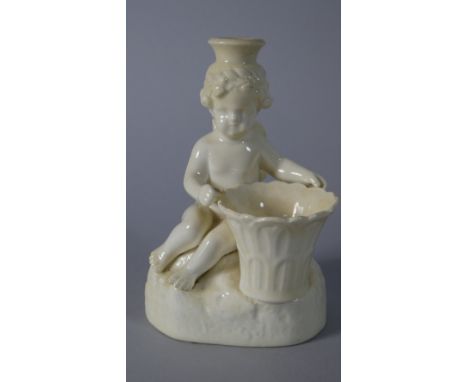 A Cream Ware Candle Stick in the Form of A Seated Cherub, 13cm High 