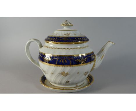 A 19th Century Chamberlains of Worcester Cobalt Blue, Gilt and White Teapot and Stand