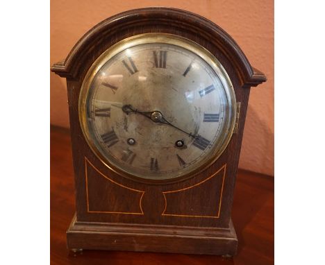 An Edwardian Oak Bracket Clock, With a silvered dial, 32cm high