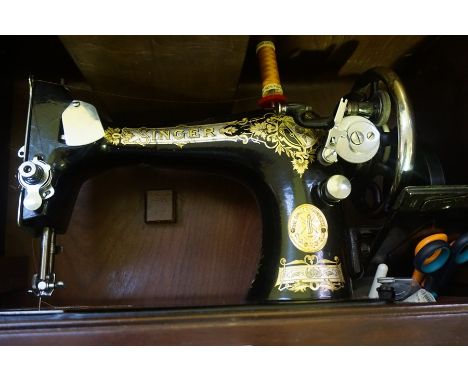 A Vintage Singer Sewing Machine, In original travel case