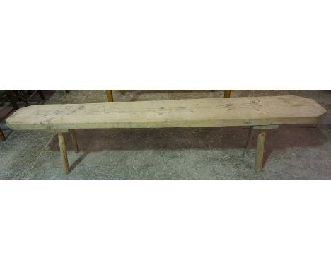 A Pine Bench, With a rectangular plank top, 43cm high, 202cm wide, 29cm deep 