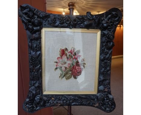 A Victorian Mahogany Pole Screen, With an adjustable needlepoint panel, raised on a cylindrical column and tripod scroll supp