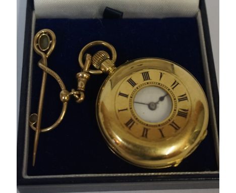 An 18 carat Gold Half Hunter Fob Watch, Stamped 18k, monogrammed to back and engraved to inside, also with a yellow metal lin