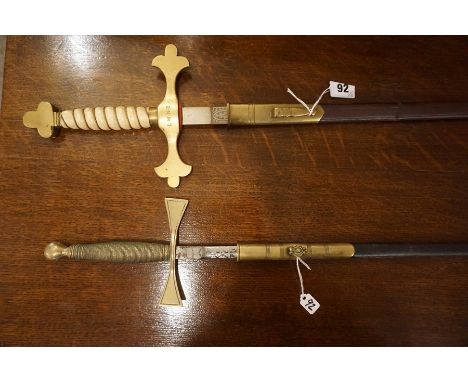 An Officers Dress Sword, circa 19th century, with a brass hilt engraved L.W.N.B, and with an ivory style grip, above an etche