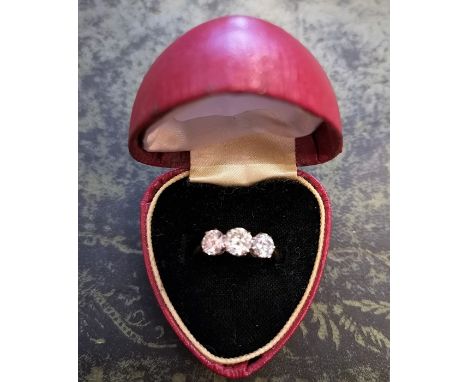 An 18ct Gold and Diamond Three Stone Ladies Ring, The centre stone measuring approximately 0.54 carat, flanked by a stone mea