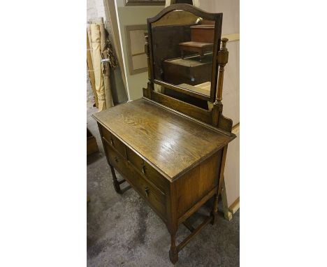 A Vintage Oak Dressing Chest, With mirror to the top, (old woodworm to back of chest), 150cm high, 92cm wide, 51cm deep 