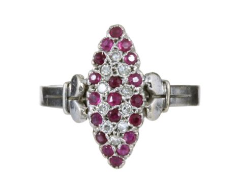 A DIAMOND AND RUBY DRESS RING in 18ct white gold, the navette shaped face jewelled with concentric rows of round cut rubies a