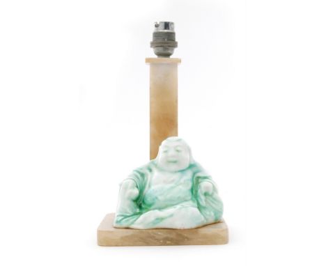 Charles Noke and Harry Nixon - Royal Doulton - A 1920s Chinese Jade model of a seated Buddha decorated in a veined green and 