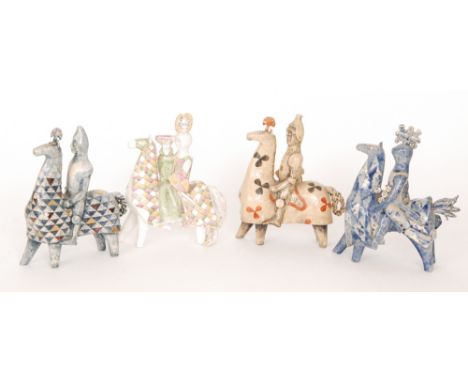 Amended image - F.G Moore - A set of four hand potted studio ceramic figures of knights on horse back with various decorative