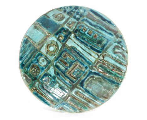 Tony Morris - Poole Pottery - A shallow charger decorated in tones of green and blue, impressed mark, monogrammed, diameter 2