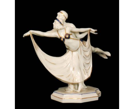 Sitzendorf - A 1920s Art Deco porcelain figure modelled as two dancers each with their leg and arm outstretched, she dressed 