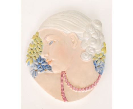 Beswick - A 1930s Art Deco 'Hyacinth Girl' face mask modelled as a lady in low profile with curled hair and wearing a pink ne