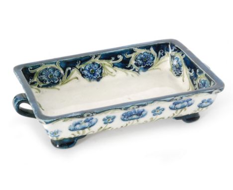 William Moorcroft - Macintyre & Co - An early 20th Century rectangular footed dish decorated in the Poppy pattern with blue f