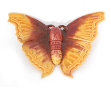 Linthorpe Pottery - A late 19th to early 20th Century majolica wall pocket formed as a butterfly glazed in red and mustard, i