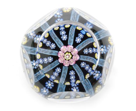 Geoffrey Baxter - Whitefriars - A post war glass paperweight internally decorated with Clichy rose style canes surrounding a 