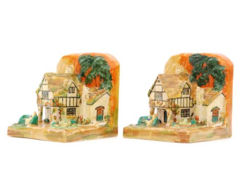Clarice Cliff - Cottage Bookends - A pair of shape 411 novelty book ends circa 1934 modelled as country houses with figures a