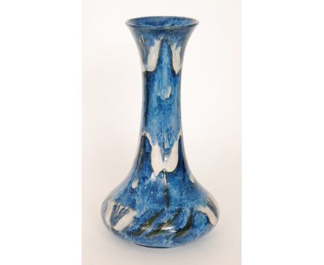 Anita Harris - Cobridge Pottery - A contemporary vase of globe and shaft form decorated in a streaked and mottled tonal blue 