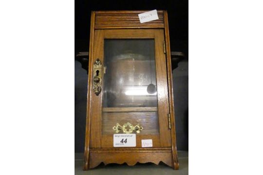 A Late 19th Early 20th Century Oak Smokers Cabinet With Pipe