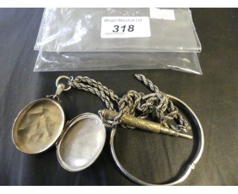 A silver oval locket and chain, together with a bangle and a pencil (4)