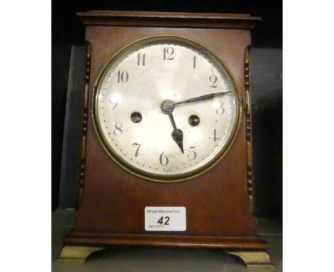 An early 20th Century mahogany cased mantel clock, with brass movement, striking on a gong.