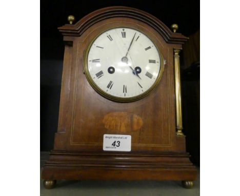 An early 20th Century mahogany cased mantel clock, presentation inscription dated April 1915.