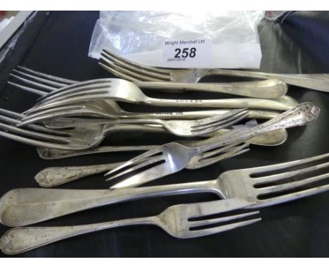 A mixed lot of silver flatware comprising six London hallmarked table forks, together with a further cake forks, various date